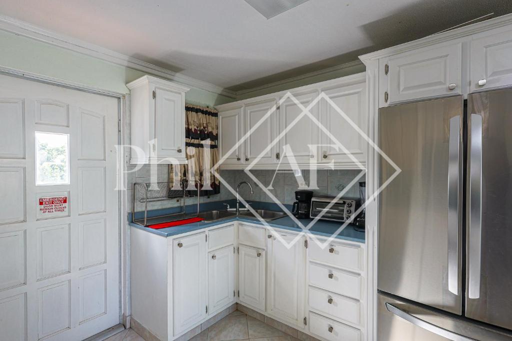 Kuchyň nebo kuchyňský kout v ubytování Spacieux Duplex de 3 chambres à Gd Case