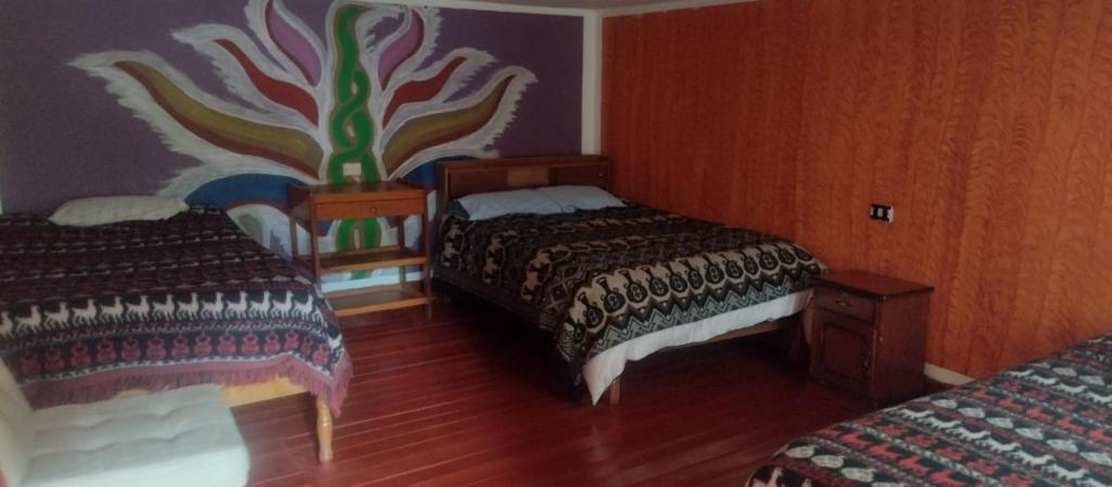 Postel nebo postele na pokoji v ubytování Hospedaje La Ñusta