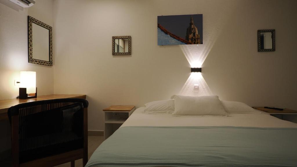 Postel nebo postele na pokoji v ubytování Hotel Casa Cytia
