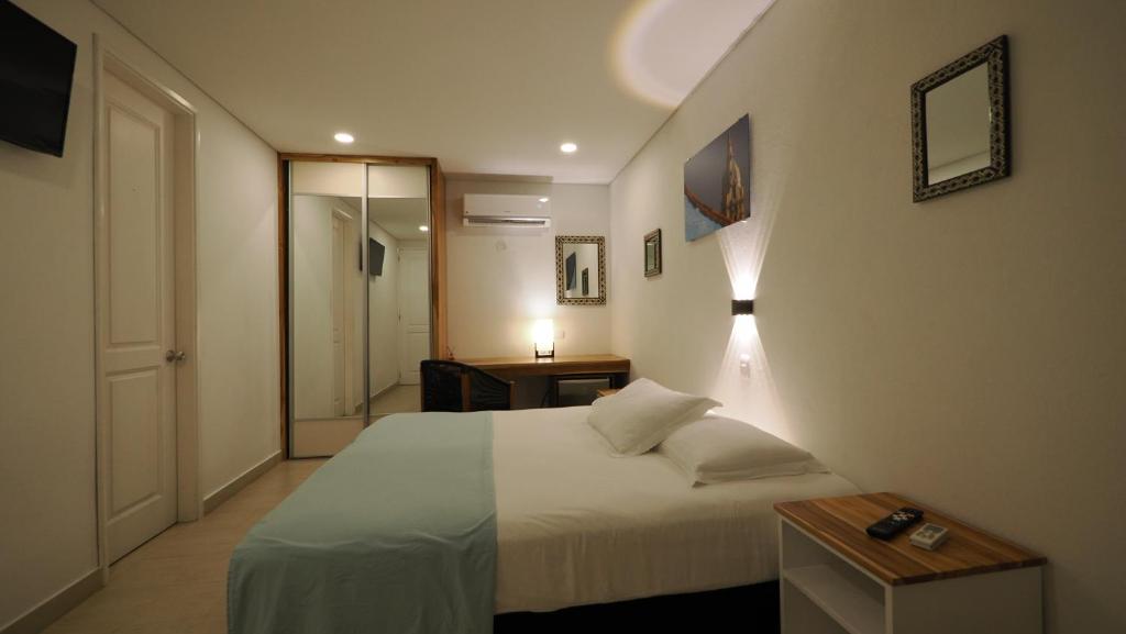 Postel nebo postele na pokoji v ubytování Hotel Casa Cytia