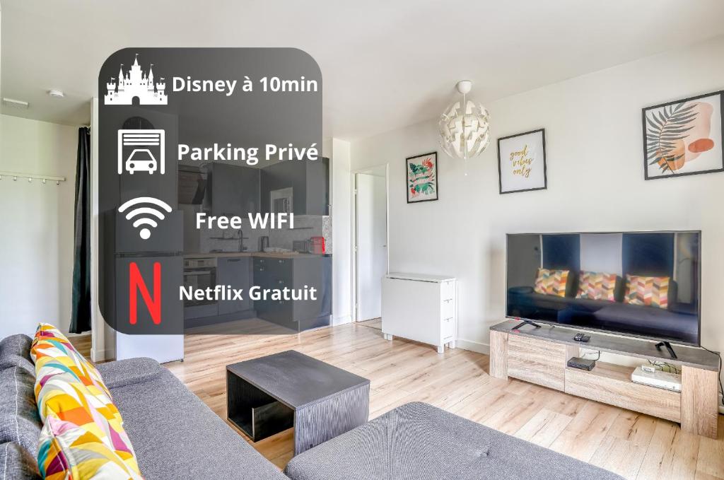 a living room with a couch and a tv at Le Convertible - Proche Disney - Parking Privé in Chalifert