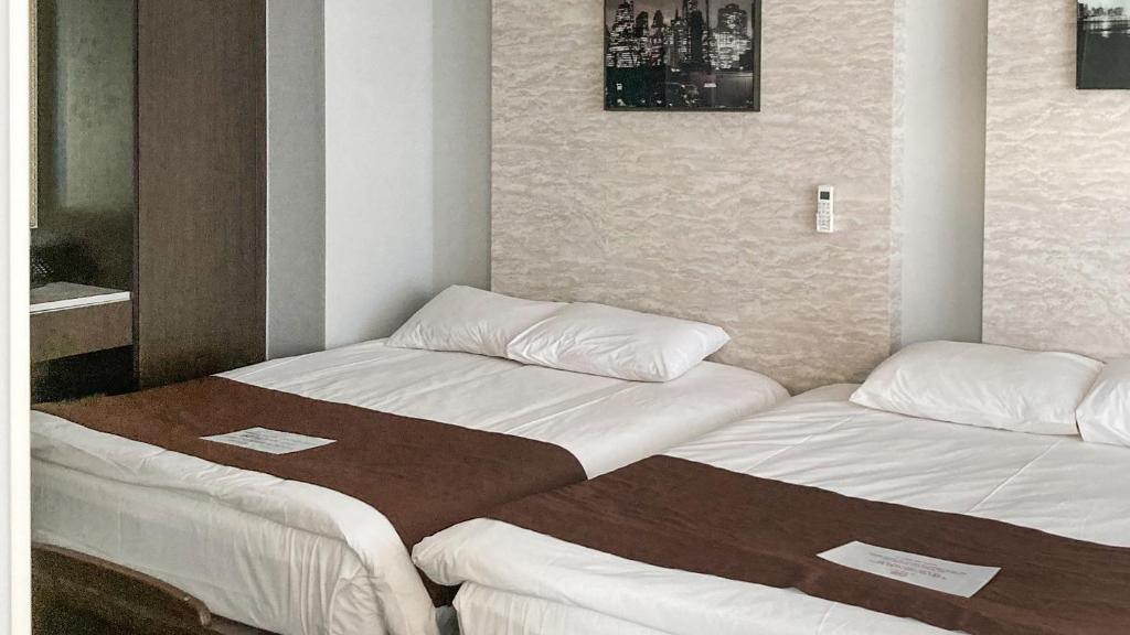 Postel nebo postele na pokoji v ubytování Griffinbay Hotel