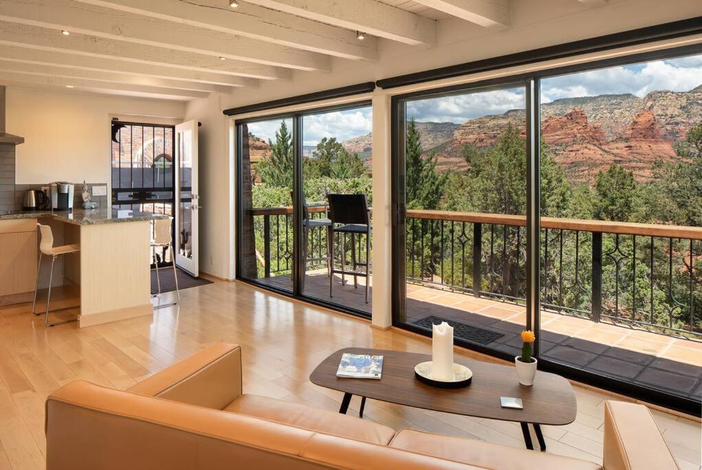 a living room with a view of the grand canyon at Private, Modern, Luxury Studio With Unmatched Red Rock Views Private Trail Head - Enjoy on property Sauna, Aromatherapy Steam Room, Hot Tub, Pools and Wellness Services in Sedona