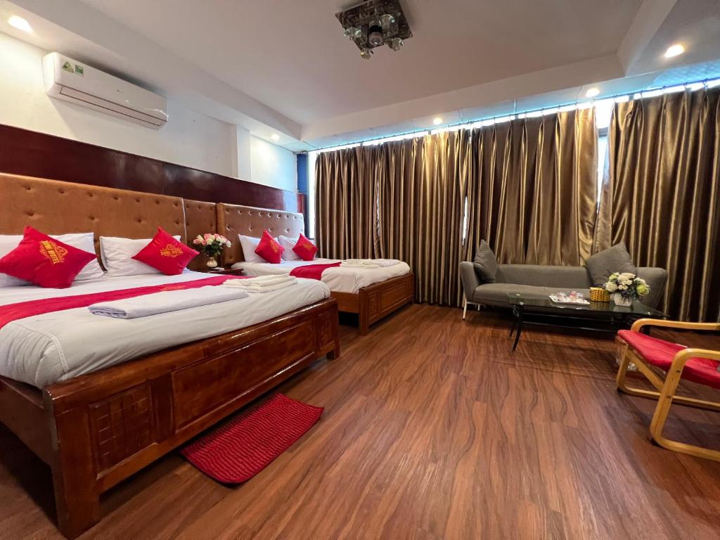 Giường trong phòng chung tại Xumi Motel Linh Đàm