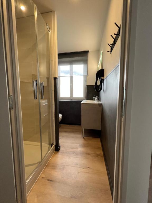 Postel nebo postele na pokoji v ubytování Hôtel Le Ponson