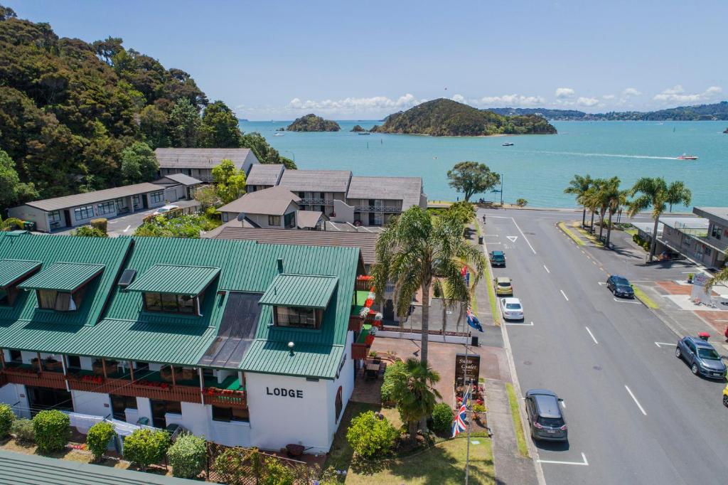 an aerial view of a town with a street and the ocean at The Swiss Chalet Holiday Apartment 3, Bay of Islands in Paihia