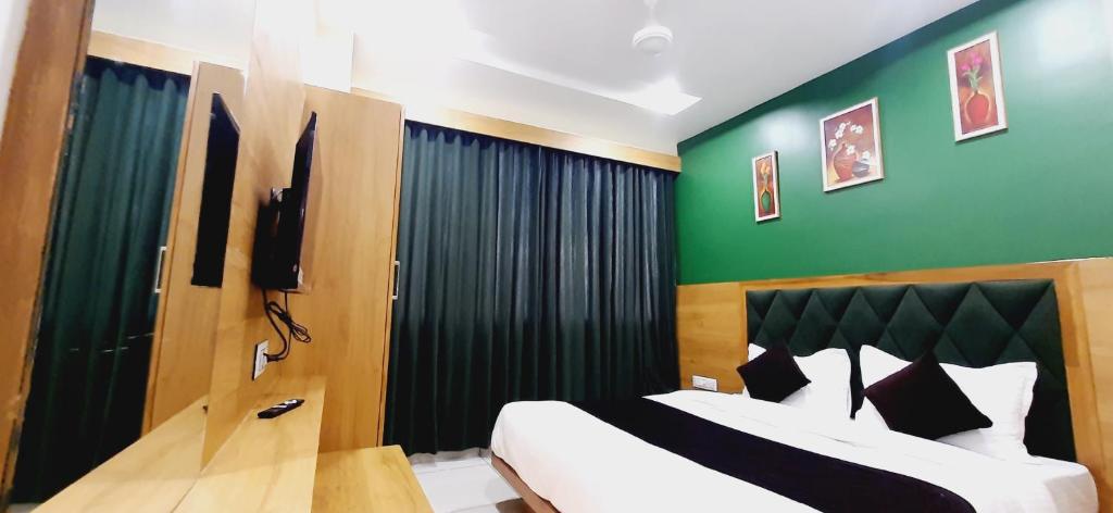 Postel nebo postele na pokoji v ubytování Hotel Suncity