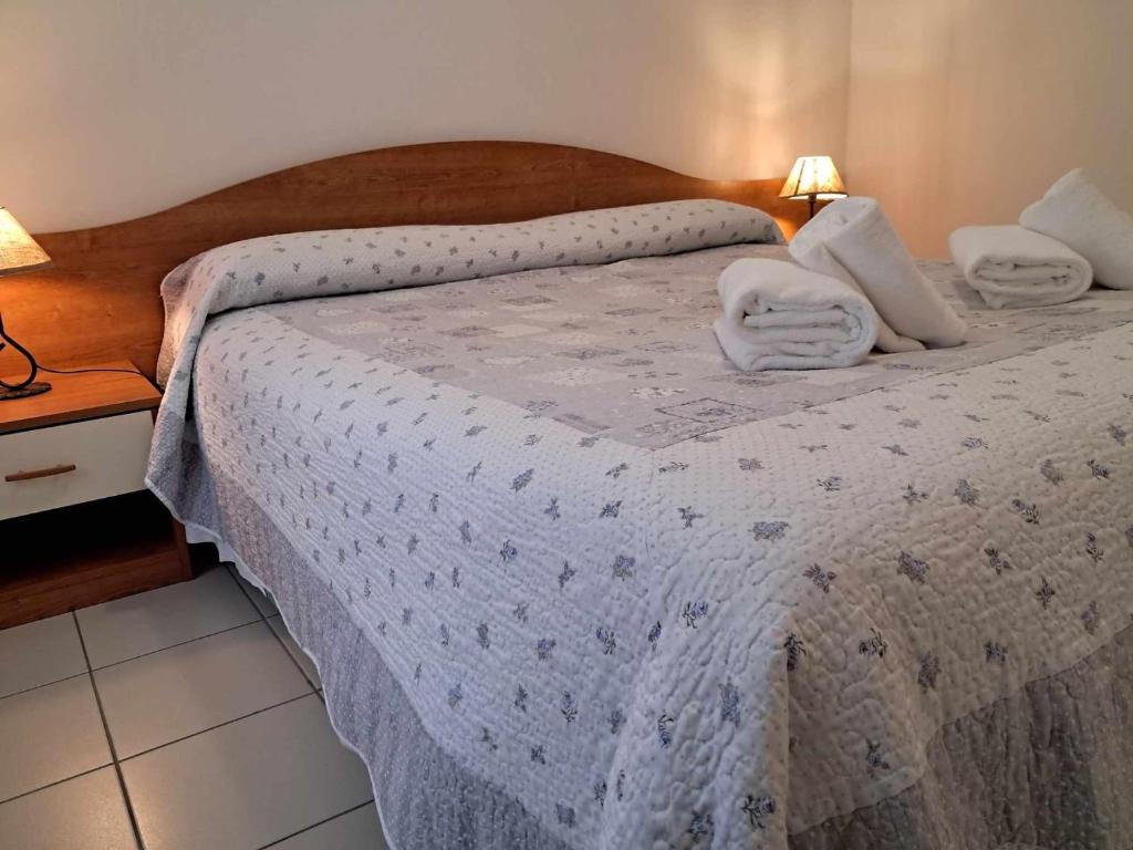 Postel nebo postele na pokoji v ubytování Albergo Martina
