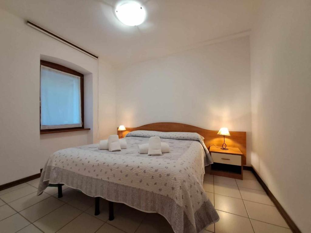 Postel nebo postele na pokoji v ubytování Albergo Martina