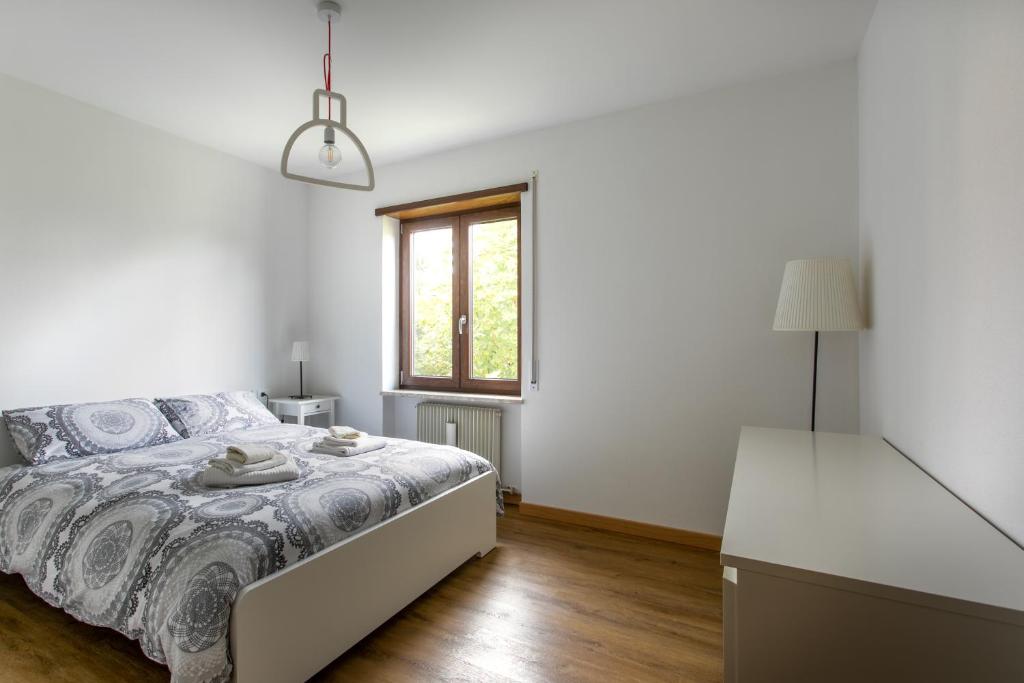 Posteľ alebo postele v izbe v ubytovaní WoodenKey Asiago bicamere immerso nel verde