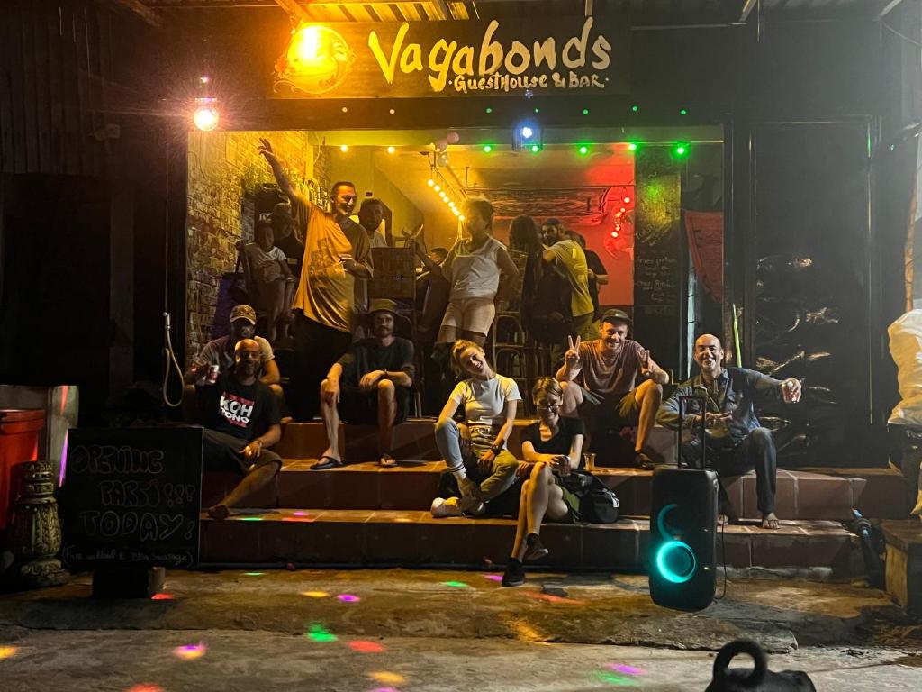 a group of people sitting on the stage at Vagabonds in Koh Rong