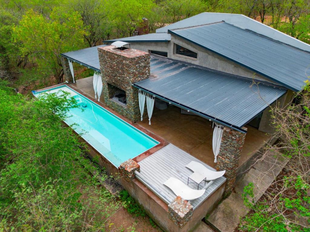 an overhead view of a house with a swimming pool at Kruger River Villas - LionsGate in Marloth Park