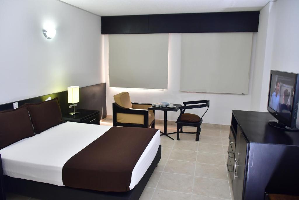 Postel nebo postele na pokoji v ubytování Hotel Tonchalá