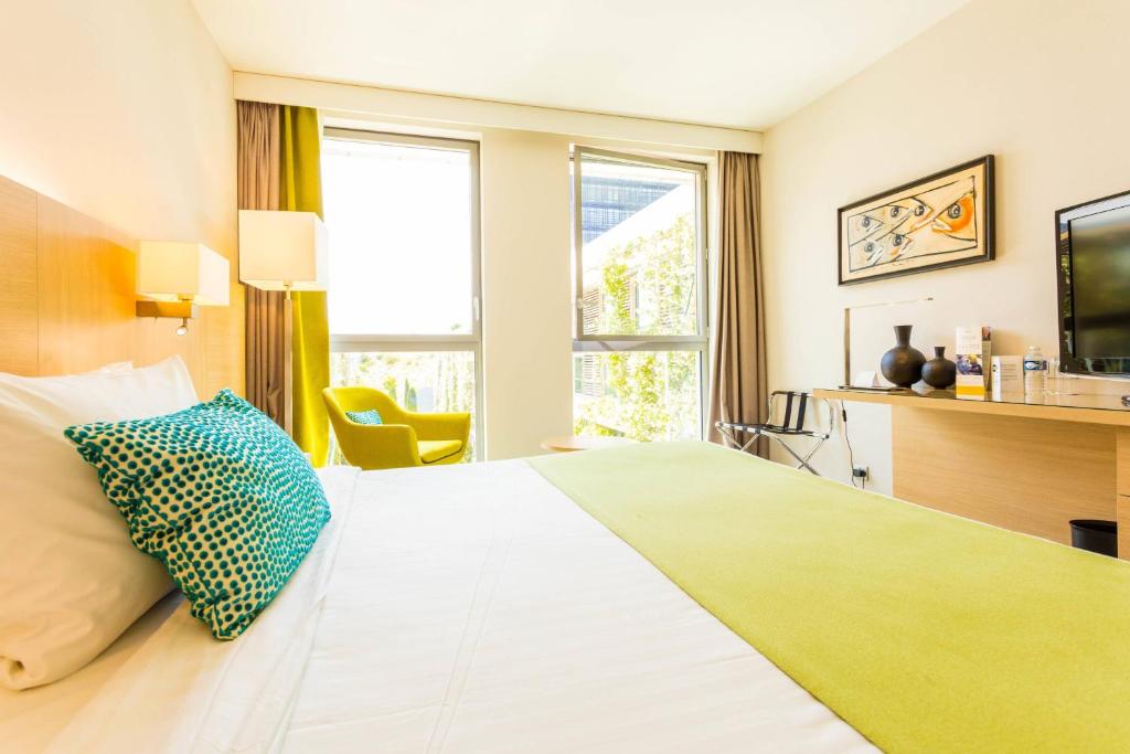 Postel nebo postele na pokoji v ubytování Courtyard by Marriott Montpellier