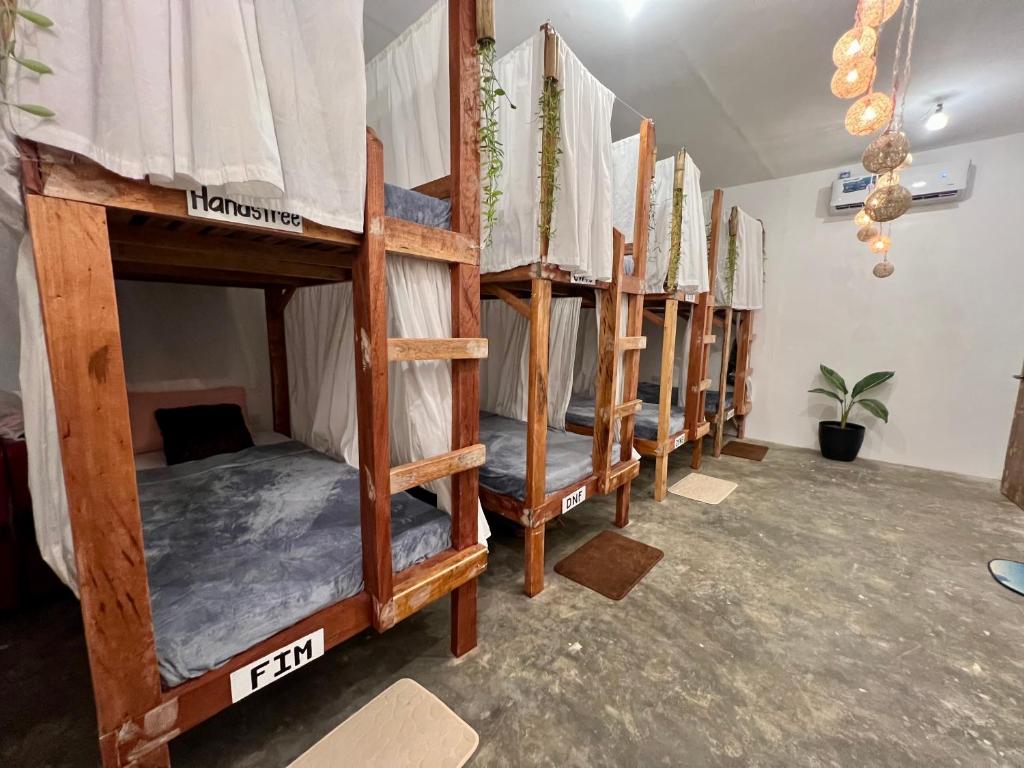 a row of bunk beds in a room at Ozen Freediving Hostel in General Luna