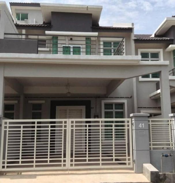 a house with a white fence in front of it at DAlyaHomestay in Malacca
