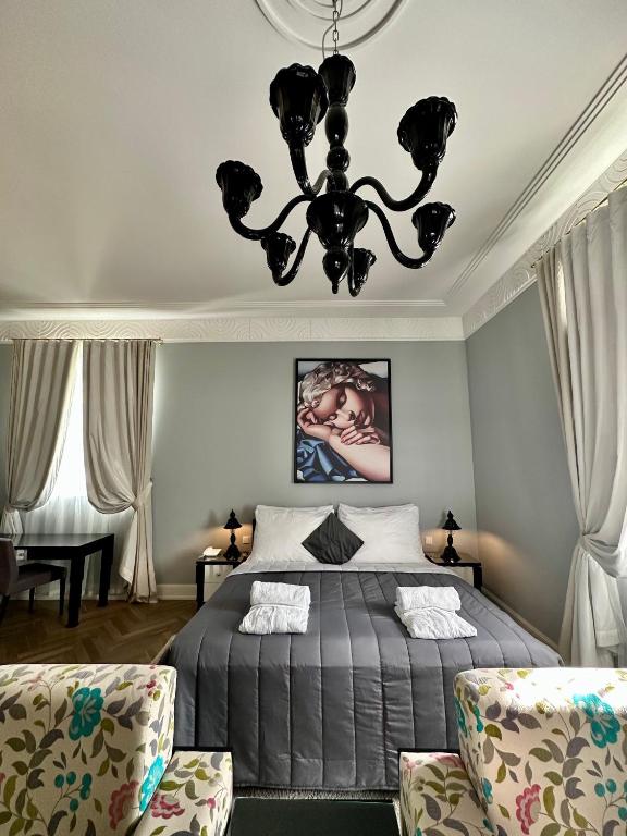 Postel nebo postele na pokoji v ubytování Art Hotel Kaštieľ