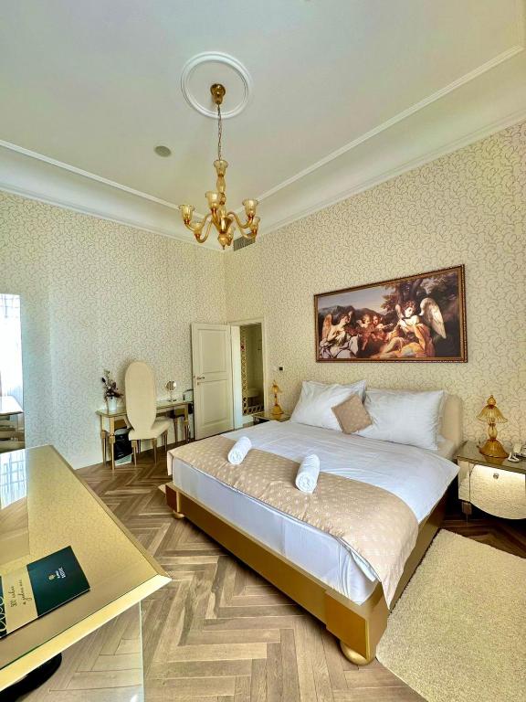 Postel nebo postele na pokoji v ubytování Art Hotel Kaštieľ