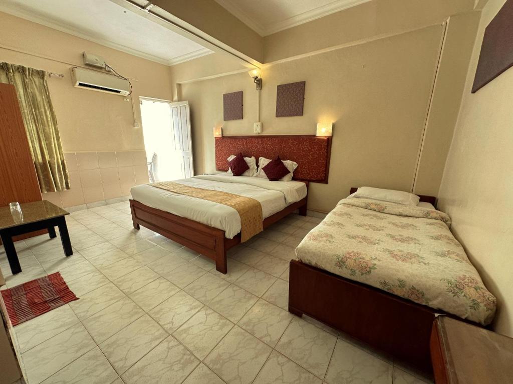 Postel nebo postele na pokoji v ubytování La Ben Resort
