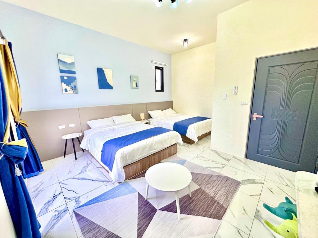 Postel nebo postele na pokoji v ubytování 睡飽飽民宿 Sleeping Well B&B 全新電梯民宿