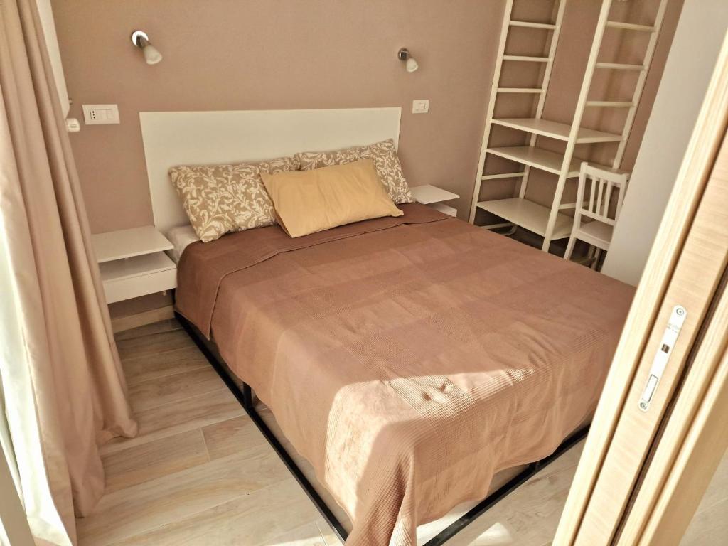 Postel nebo postele na pokoji v ubytování SENTIERI DEL GARDA