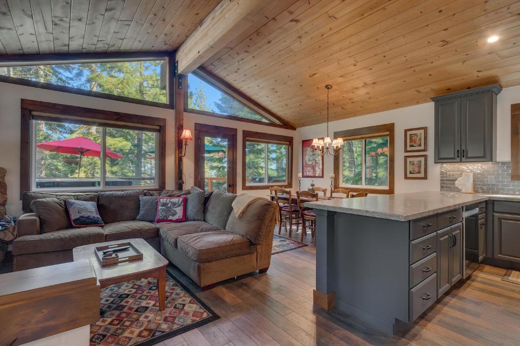 a kitchen and living room with a couch and a table at Silver Tip at Tahoe Park w HOA amenities - 3BR Pet Friendly, Hot Tub, Tahoe City in Tahoe City
