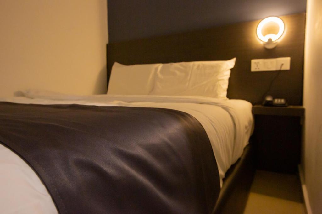 Ліжко або ліжка в номері 1 Hotel Signature