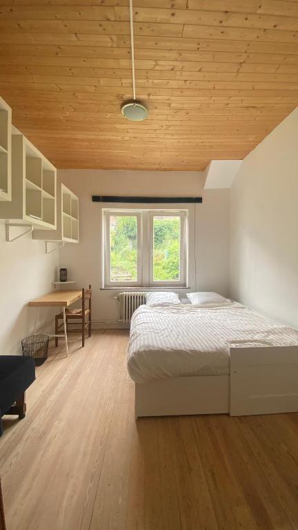 Postel nebo postele na pokoji v ubytování Studio vue sur Meuse