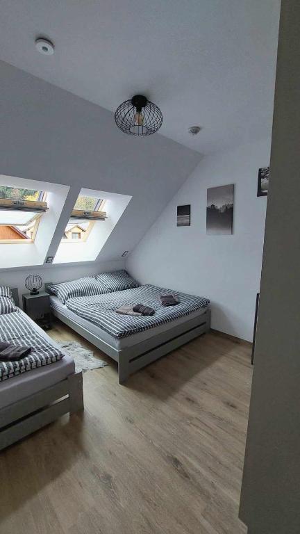 Postel nebo postele na pokoji v ubytování Apartmán Štěpa