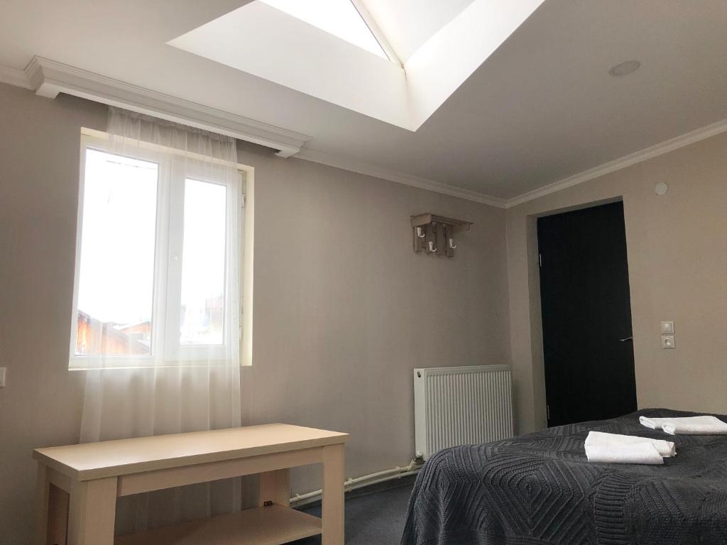 Postel nebo postele na pokoji v ubytování Guest House Vanda