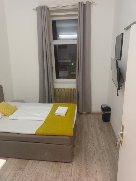 Postel nebo postele na pokoji v ubytování Speedyrooms Vienna