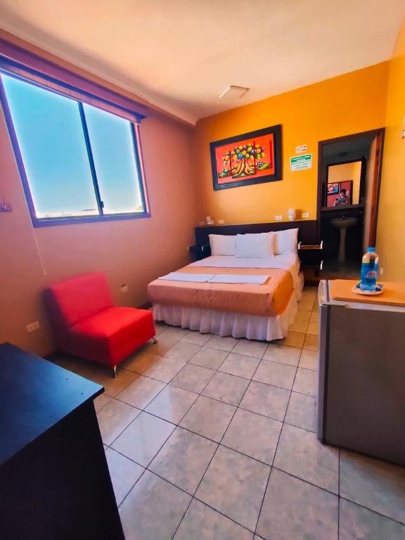 Postel nebo postele na pokoji v ubytování Hotel Los Algarrobos