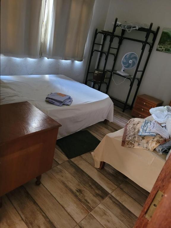 Postel nebo postele na pokoji v ubytování Casa de Temporada Piumhi