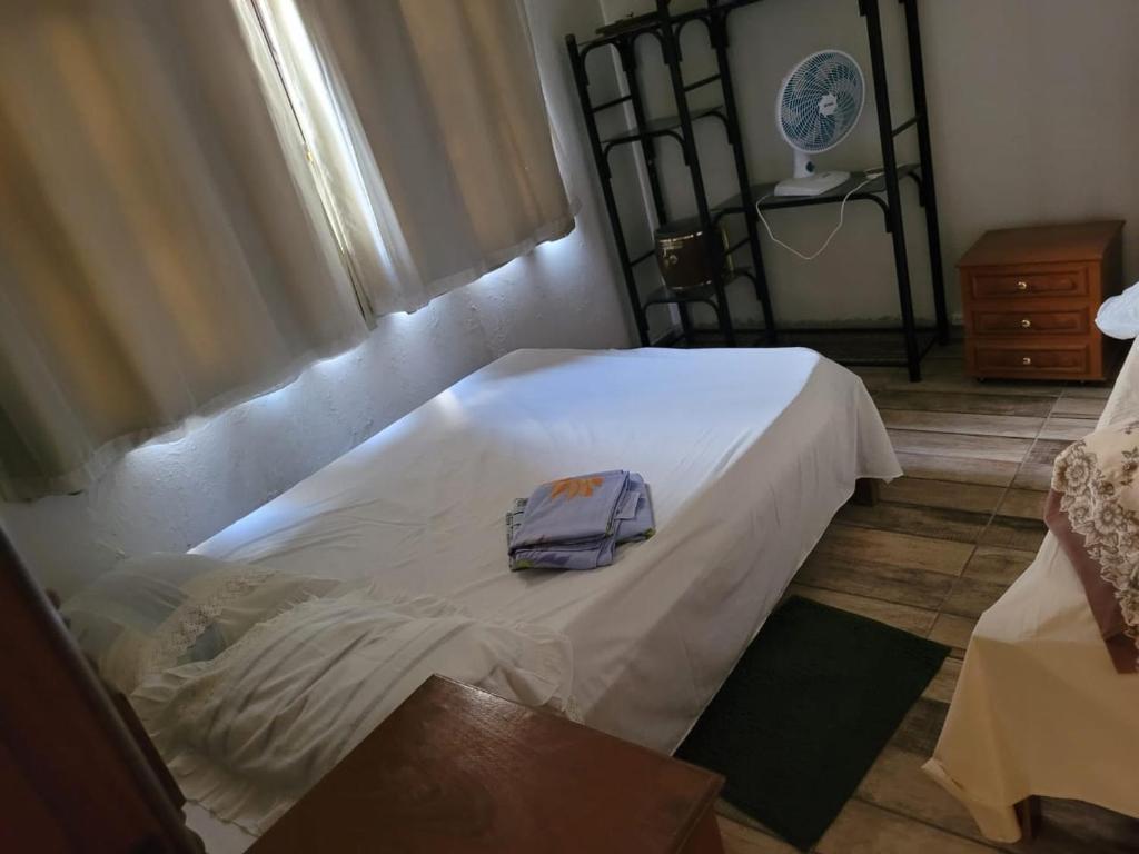 Postel nebo postele na pokoji v ubytování Casa de Temporada Piumhi