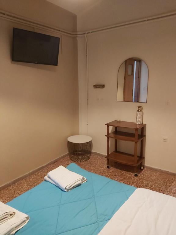 Postel nebo postele na pokoji v ubytování Ermis Hotel