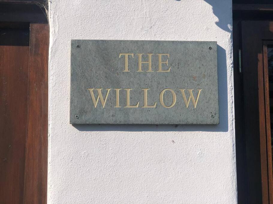 a sign on a wall that reads the willow at The Willow (Alton Towers, Animals, Peak District) in Denstone