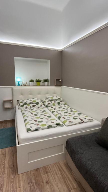 a large bed in a room with at Mirage Apartments Váci Street in Budapest