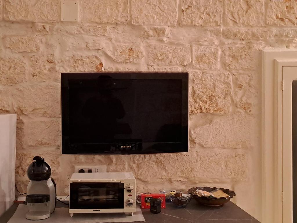 Telewizja i/lub zestaw kina domowego w obiekcie La Casuccia
