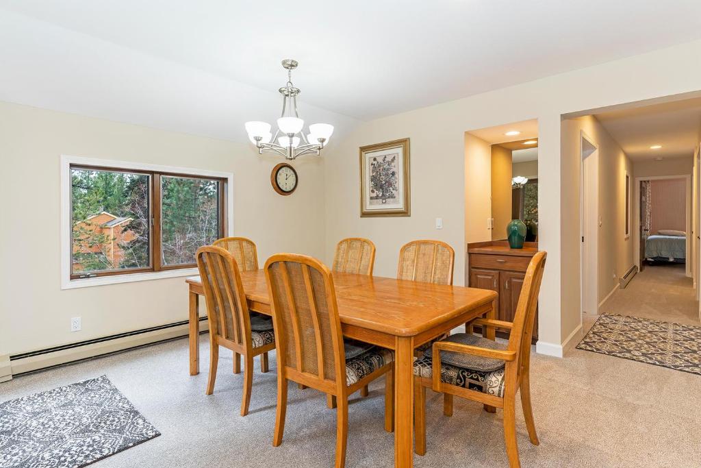 a dining room with a wooden table and chairs at 47 McCloud - Upper Unit 3 Bedrooms in Incline Village