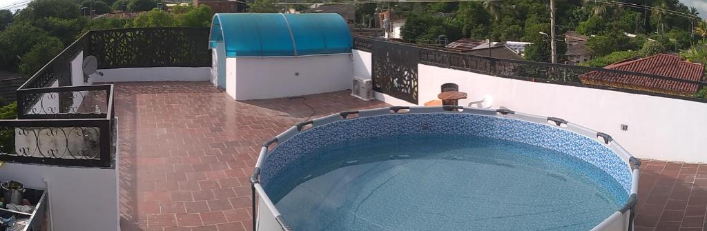 a swimming pool on top of a building at La Reserva de UBA in El Socorro