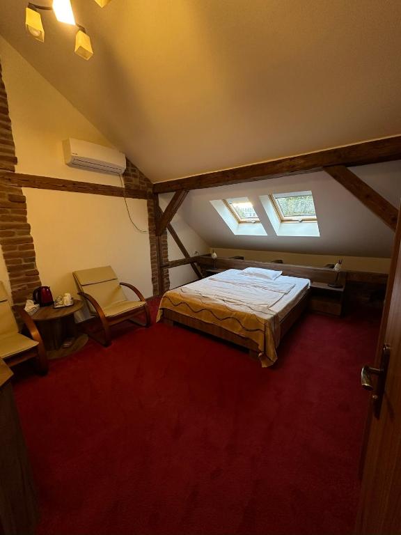 Postel nebo postele na pokoji v ubytování Antique ApartHotel