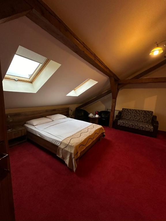 Postel nebo postele na pokoji v ubytování Antique ApartHotel