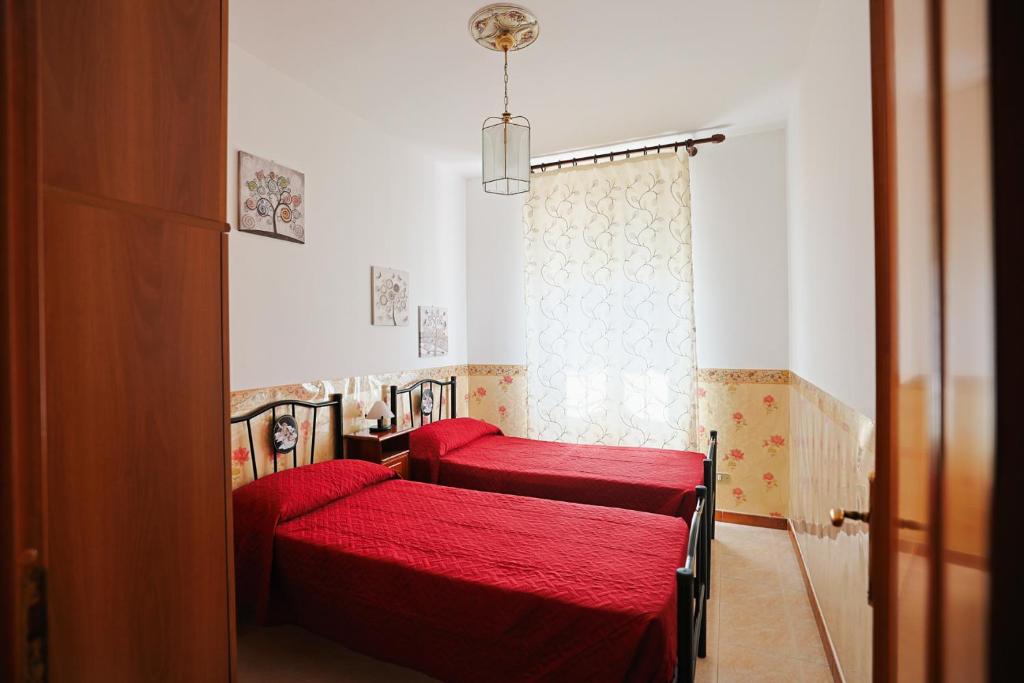 Postel nebo postele na pokoji v ubytování Le Rose di Lena