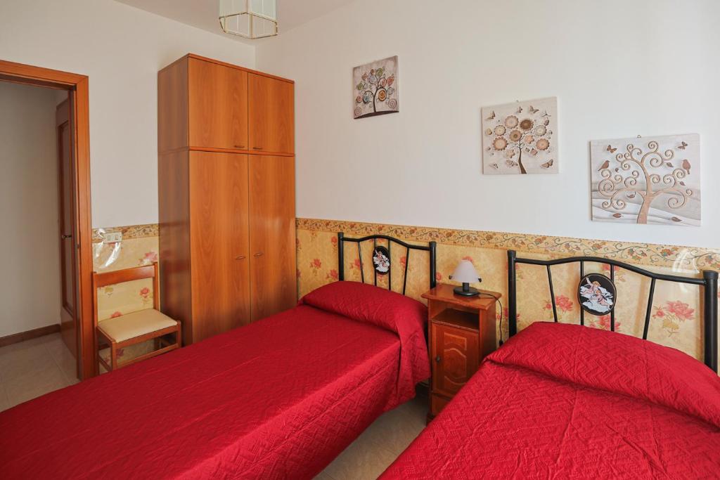 Postel nebo postele na pokoji v ubytování Le Rose di Lena