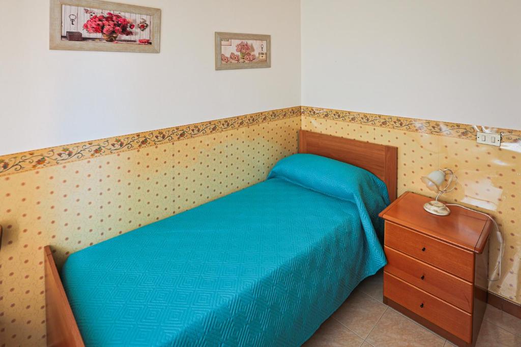 Postel nebo postele na pokoji v ubytování Le Rose di Lena