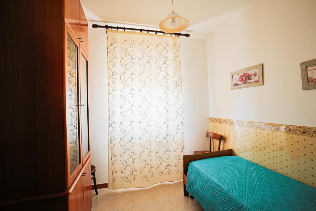Postel nebo postele na pokoji v ubytování Le Rose di Lena