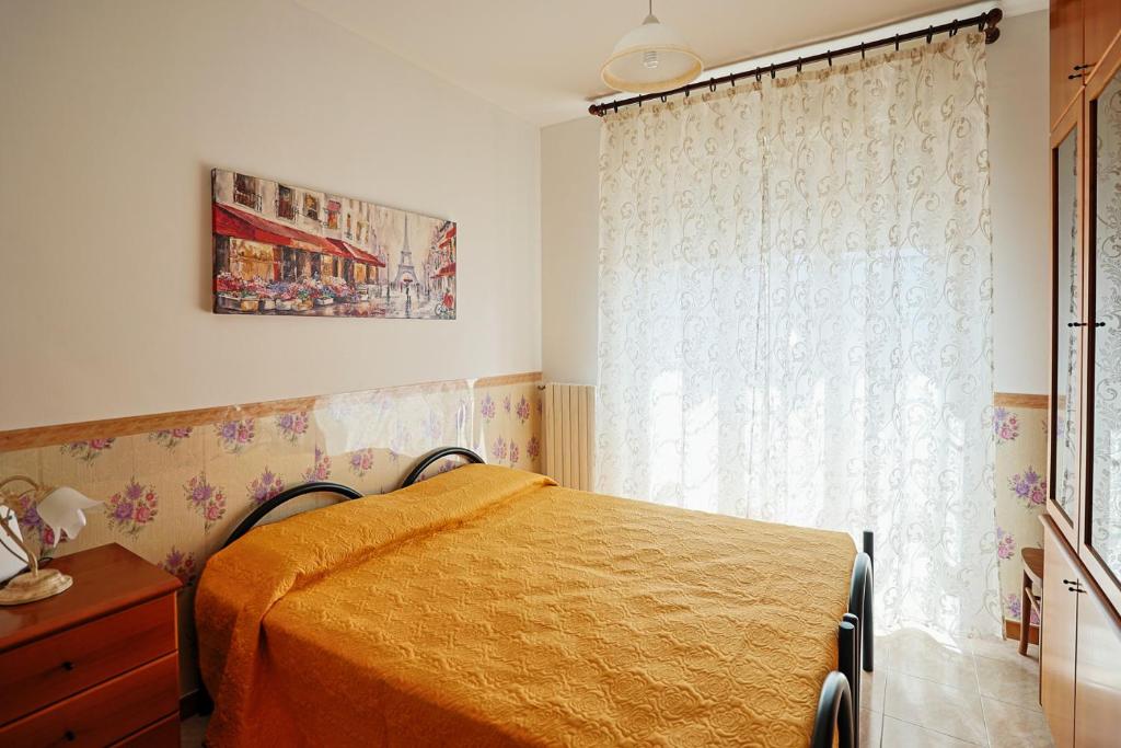 Postel nebo postele na pokoji v ubytování Le Rose di Lena