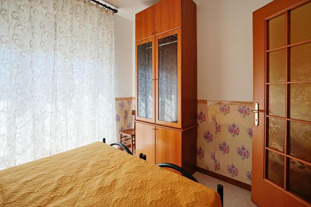 Postel nebo postele na pokoji v ubytování Le Rose di Lena