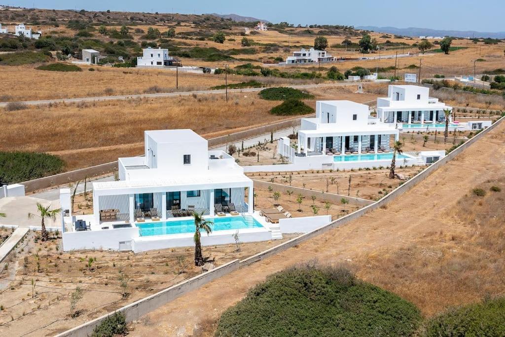 an aerial view of a white house with a pool at Seafish Villa, 2 Luxury Villas at Lachania Beach in Lachania