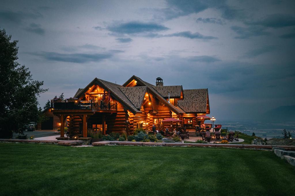 a large log cabin with a large roof at Coyote Bluff Estate in Somers